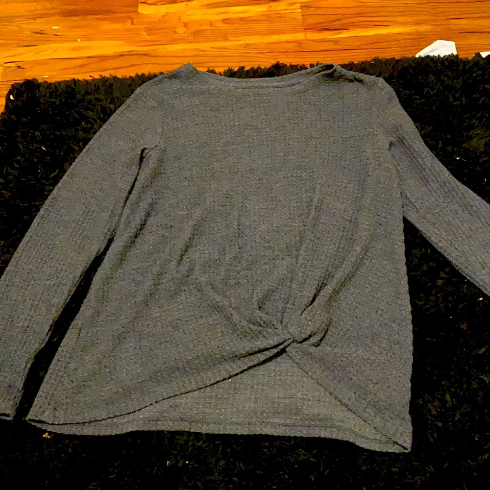 Gray long sleeve kids top tide at the bottom